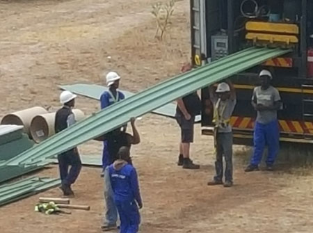 Cape Roof - Rolling Continuous Lenght Sheets on Site