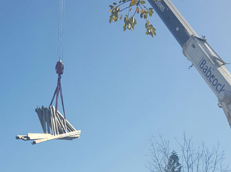 Cape Roof - Lifting Trusses with Crane to Multi Storey Building